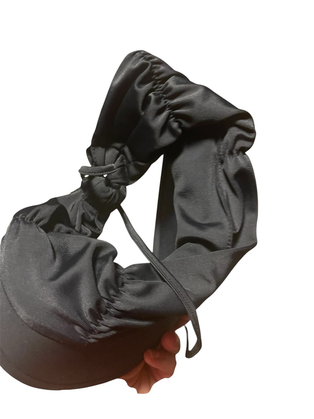 Uvskins Black visor with Adjustable Tie in the back.